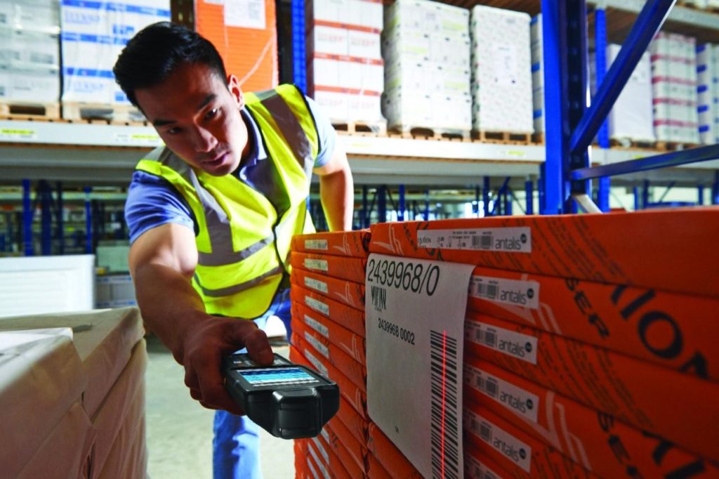 Employee Scanning a barcode with Viewpoint fo SyteLine .