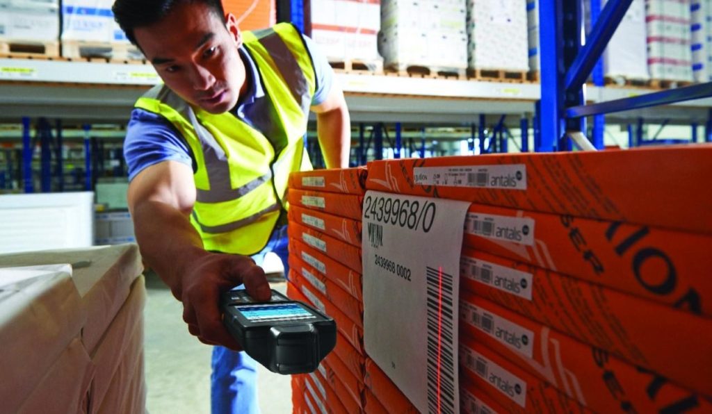 Employee Scanning Barcode on Skid to improve inventory accuracy using Viewpoint for Infor LX